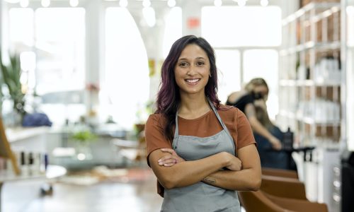 Smiling small beauty salon owner